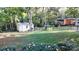 A fenced in backyard with a shed and play area at 1000 Hunting Ave, Lincolnton, NC 28092