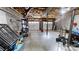 Unfinished basement with two garage doors, concrete floor and a storage system at 1000 Hunting Ave, Lincolnton, NC 28092