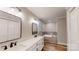 Bathroom featuring double vanity, modern fixtures, and a built-in tiled bathtub at 1000 Hunting Ave, Lincolnton, NC 28092