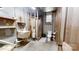 Rustic bathroom featuring a utility sink, exposed plumbing, and a compact shower and toilet at 1000 Hunting Ave, Lincolnton, NC 28092