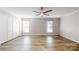 This bedroom features wood-look floors, neutral paint, ceiling fan, and double-door closet at 1000 Hunting Ave, Lincolnton, NC 28092