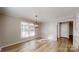 Light-filled dining area with hardwood floors and elegant chandelier at 1000 Hunting Ave, Lincolnton, NC 28092