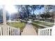 View from the front door showcasing the entrance, porch and front yard landscape at 1000 Hunting Ave, Lincolnton, NC 28092