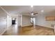 Large living room with hardwood floors, a ceiling fan and stairway to the second floor at 1000 Hunting Ave, Lincolnton, NC 28092