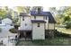 Exterior view of the back of the home featuring a deck and well-maintained yard at 1000 Hunting Ave, Lincolnton, NC 28092