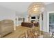 Cozy living room with hardwood floors, fireplace, and natural light at 1134 Willow Oaks Trl, Matthews, NC 28104