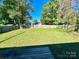 Large backyard with a wood fence creating a private outdoor space at 125 Pineville Rd, Statesville, NC 28677