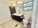 Bright bathroom featuring a double vanity, tile flooring, and storage at 125 Pineville Rd, Statesville, NC 28677