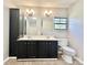 Bathroom with double vanity, tile floor, and a storage cabinet at 125 Pineville Rd, Statesville, NC 28677