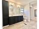 Bathroom featuring a double vanity, tile flooring, and large cabinet at 125 Pineville Rd, Statesville, NC 28677