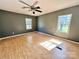 Bedroom with hardwood floors, a ceiling fan, and natural light at 125 Pineville Rd, Statesville, NC 28677