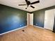 Spacious bedroom with a ceiling fan and wood floors at 125 Pineville Rd, Statesville, NC 28677