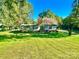 Well-maintained home with a large front yard and mature trees at 125 Pineville Rd, Statesville, NC 28677