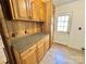 A kitchen area featuring wood-paneled walls and a door to the outside at 125 Pineville Rd, Statesville, NC 28677