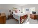 Cozy bedroom with wooden sleigh bed and window at 155 Harper Lee St, Davidson, NC 28036