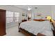 Bright bedroom with a queen-size bed and access to additional living space at 155 Harper Lee St, Davidson, NC 28036