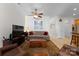 Relaxing Gathering room with sofa, TV, and wooden storage chest at 155 Harper Lee St, Davidson, NC 28036