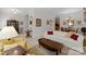 Spacious living room with white sofa, wooden coffee table, and view of dining area at 155 Harper Lee St, Davidson, NC 28036