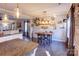 Kitchen dining area with rustic wood wall and a wooden table with four chairs at 7324 Friar Tuck Ln, Mint Hill, NC 28227