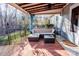 Covered patio with wicker furniture and ceiling fan at 7324 Friar Tuck Ln, Mint Hill, NC 28227