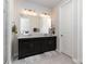 Double vanity bathroom with modern fixtures and mirror at 112 Atterberry Aly, Charlotte, NC 28217