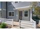 Modern gray exterior with a private entrance and small white fence at 112 Atterberry Aly, Charlotte, NC 28217