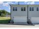 Attached garage with white door and ample space for two cars at 112 Atterberry Aly, Charlotte, NC 28217