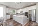 Modern kitchen with white cabinets, stainless steel appliances, and island at 112 Atterberry Aly, Charlotte, NC 28217