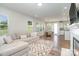 Living Room with L-shaped sofa and view of fireplace and kitchen at 112 Atterberry Aly, Charlotte, NC 28217