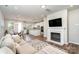 Open living room showcasing a cozy fireplace and adjacent kitchen at 112 Atterberry Aly, Charlotte, NC 28217