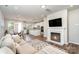 Open living room showcasing a cozy fireplace and adjacent kitchen at 112 Atterberry Aly, Charlotte, NC 28217