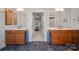 Double vanity bathroom with upgraded cabinetry and tile flooring at 115 Hawk Run Ln, Troutman, NC 28166