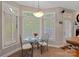 Charming breakfast nook with glass table and built-in seating at 115 Hawk Run Ln, Troutman, NC 28166