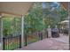 Relaxing deck with sunroom access and wooded views at 115 Hawk Run Ln, Troutman, NC 28166