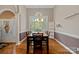 Bright dining room with hardwood floors and large window at 115 Hawk Run Ln, Troutman, NC 28166