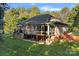 Brick house with deck, sunroom, and nicely landscaped yard at 115 Hawk Run Ln, Troutman, NC 28166