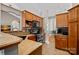 Kitchen with wood cabinets, tile floor, and stainless steel appliances at 115 Hawk Run Ln, Troutman, NC 28166