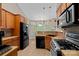 Well-equipped kitchen with wood cabinets and tile flooring at 115 Hawk Run Ln, Troutman, NC 28166