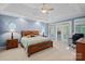 Main bedroom with wood flooring and access to private patio at 115 Hawk Run Ln, Troutman, NC 28166