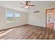 Bright bedroom featuring vinyl flooring and a pair of windows providing natural light at 13079 Philadelphia Church Rd, Oakboro, NC 28129