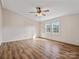 Cozy bedroom with vinyl flooring and plenty of natural light from the two windows at 13079 Philadelphia Church Rd, Oakboro, NC 28129