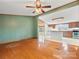 Open-concept living room showcasing the seamless connection to the well-equipped kitchen at 13079 Philadelphia Church Rd, Oakboro, NC 28129