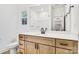 Modern bathroom featuring a light wood vanity, stylish fixtures, and an elegant mirror at 337 Autumn Dr, Harrisburg, NC 28075