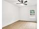 Bedroom featuring a ceiling fan, window, and wood-look floors at 337 Autumn Dr, Harrisburg, NC 28075