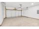 Spacious two car garage featuring an automatic garage door and painted concrete flooring at 337 Autumn Dr, Harrisburg, NC 28075