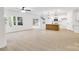 Open concept living room and kitchen with lots of natural light and wood floors at 337 Autumn Dr, Harrisburg, NC 28075