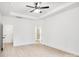 Bright and spacious bedroom featuring a tray ceiling, and wood-look floors at 337 Autumn Dr, Harrisburg, NC 28075