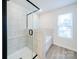 Bathroom with a walk-in shower and a window at 34 Porter Nw St # Sw34, Concord, NC 28027