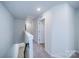 Upstairs hallway with carpeted floors and access to bedrooms at 34 Porter Nw St # Sw34, Concord, NC 28027