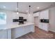 Modern kitchen with white cabinets, quartz countertops and geometric backsplash at 34 Porter Nw St # Sw34, Concord, NC 28027